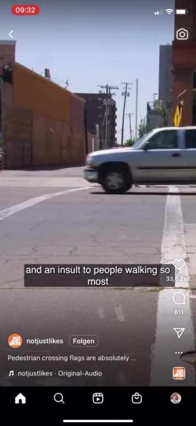 A solution for pedestrian road safety involving orange flags.