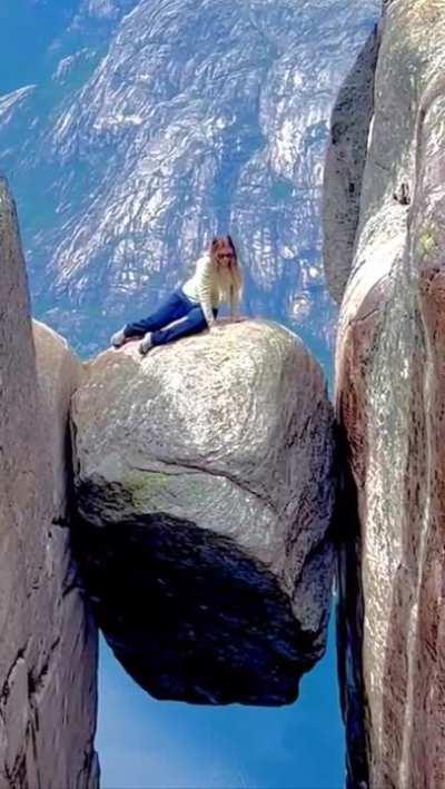 Climbing on wedged boulder