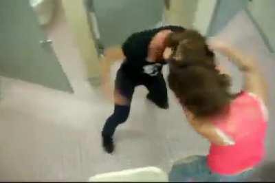 two girls throwing wild punches