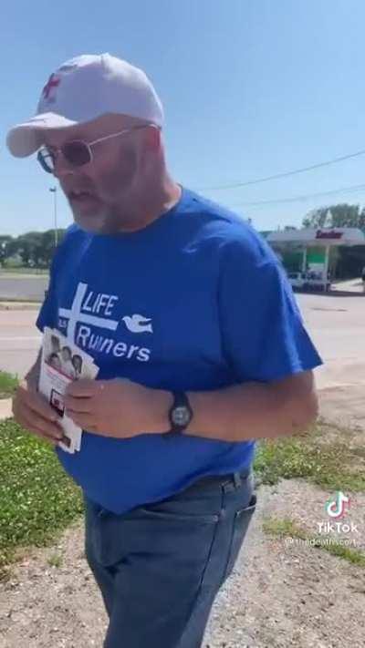 Anti-choice protesters use a “health clinic“ bus that has an advertisement showing a doctor on the bus without a doctor actually being present