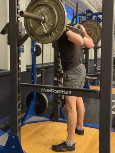 Is my squat deep enough? Is it ok to use the safety bars as my guide?