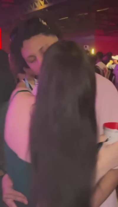 Famous youtuber kissing in a party