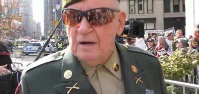 Feminists disrespect US veteran during Veterans Day Parade.