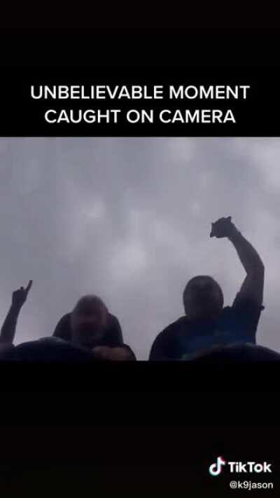 Catching a phone in the air during a roller-coaster.