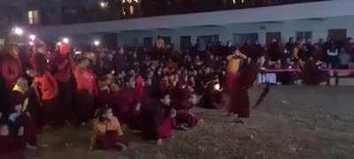 Tibetan monks celebrate the final kick of Argentina's world cup victory