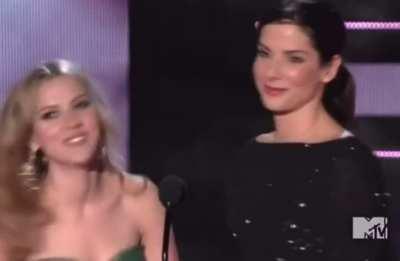 You can tell by her eyes how much Scarlett Johansson loved being kissed by Sandra Bullock. I wonder what else they get up to.