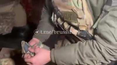 RU POV: Wagner fighter flashing all of the brigade patches taken off fallen Ukranian Soldiers in Soledar
