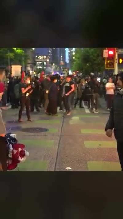 Mexican man stops activists from burning American flag at ICE protest