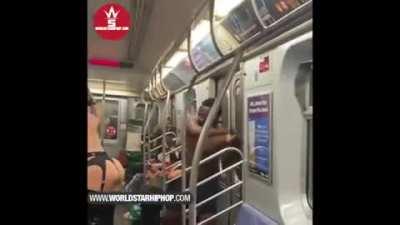 A little interracial BDSM on a New York subway to start the day
