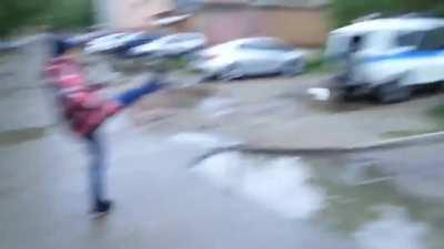 Kicking stuff at a police car