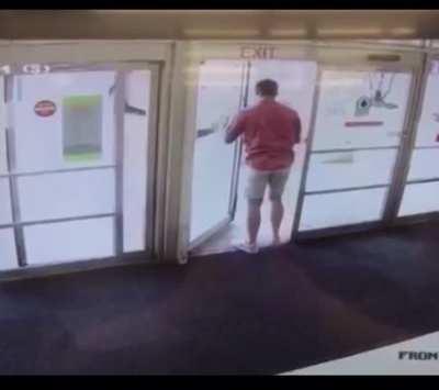 the exit sign is above a hinged door when there is a sliding door next to it