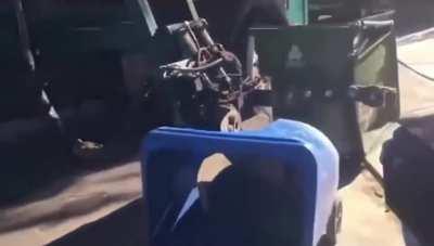 Probably his first day driving the side loader truck