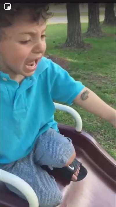 Little boy freaks out over a tiny frog
