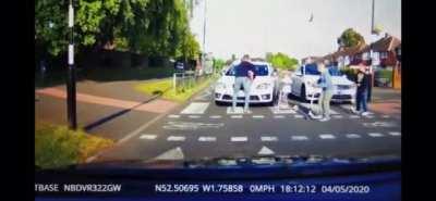 Impatient Driver nearly hits kids at crossing, Dad jumps in front of car to save the day.