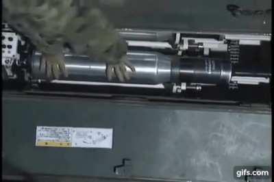 Reloading of a Japanese Type 90/Type 10 bustle autoloader ready rack