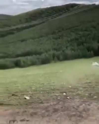 Using front-loader & sling to upright an overturned vehicle, its owner will surely be pleased