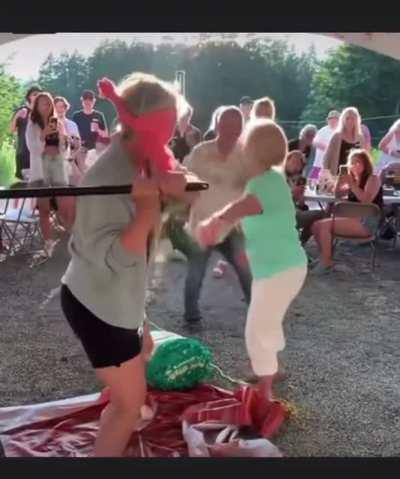 Grandma tries to pick up a piñata and becomes the piñata