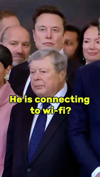 Elon Musk at Trump's inauguration: lost in his own world, connecting to his wifi through his mind?