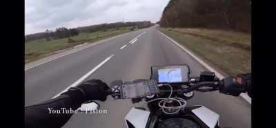 A biker snucks between two others at 160km/h