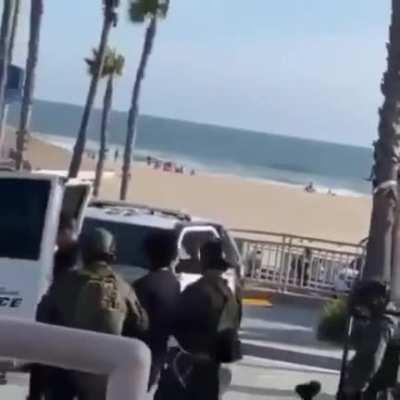 To arrest a man for protesting