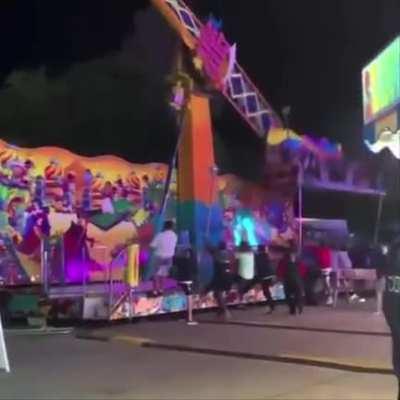 Bystanders at the Cherry Festival in Traverse City, Michigan rushed over to stop a carnival ride from tipping over
