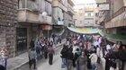 Heartbreaking clip shows SAA artillery shell hitting a market in Aleppo as a girl sings for freedom. 2012
