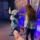 'Ezra' a service dog gets a well deserved break to go to meet her favorite character Stitch