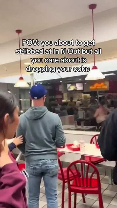 Half naked man stabs the windows of an In-N-Out Burger with a knife