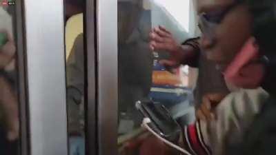 Crowd tries to force themselves inside a Goodwill store