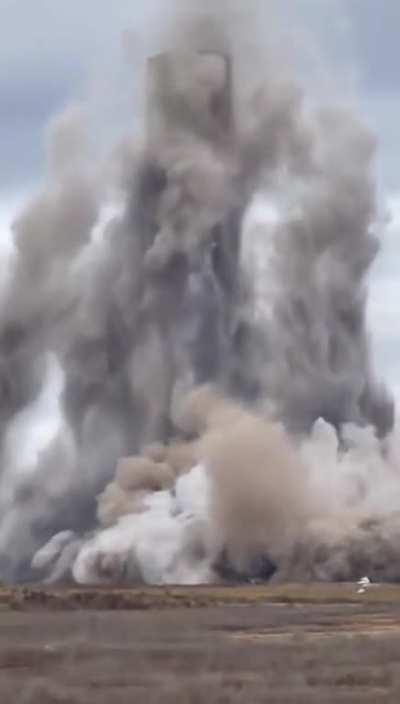 The demolition company was supposed to take down four chimneys and leave the fifth standing