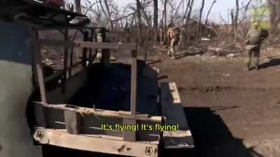 Russian soldiers attempting to tow a vehicle encounter a Ukrainian FPV drone, they try to shoot it down with their rifles (with English subtitles, Unknown date)