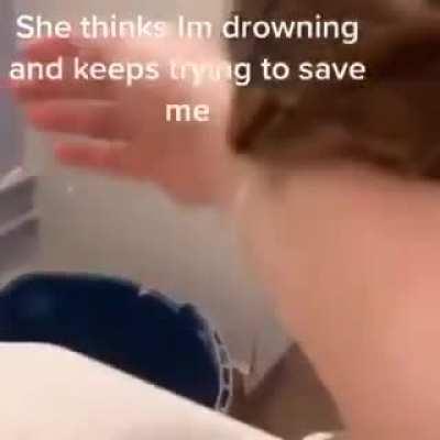Cat thinks owner is drowning