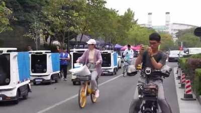 Alibaba is deploying over 1,000 delivery bots across Chinese university campuses and urban communities this year. The bots, called Xiaomanlv, can deliver about 50 packages at a time and as many as 500 boxes in one day, covering 100 kilometers on a single 