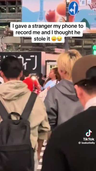 She gave her phone to a stranger to take a pic at Shibuya Crossing, but when she turned back around, the crowd was already moving, and she couldn’t remember who she'd given her phone to.