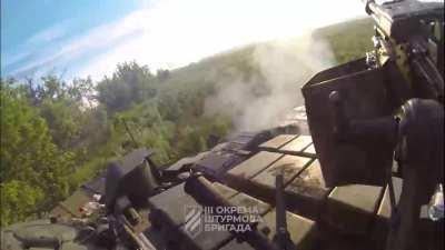 Commander POV of a Ukrainian Tank of the 3rd Assaut Brigade shooting at Russian Positions in the Bakhmut Area. 2023.