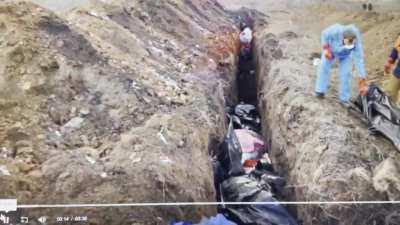 NSFW mass graves being dug in Ukraine.