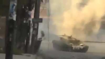 Early-war Liwa al-Tawhid RPG attack on a Syrian Army T-72 as it rounds a corner - Aleppo - 9/10/2012