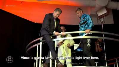 Vince at 74, showing Gronk how to take a bump