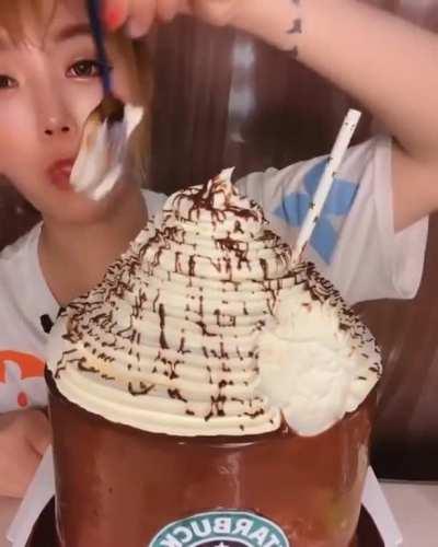 The whipcream is trying to get away from her.