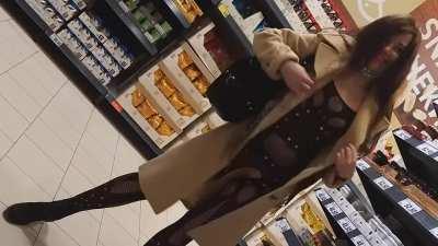 naughty woman shows her ass in a store