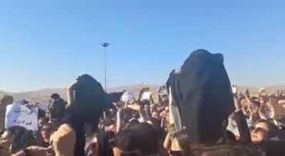 Women of Iran removing their hijabs while screaming 