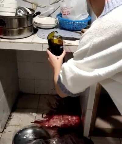 DBS cutting open the wine bottle with a butchers knife!