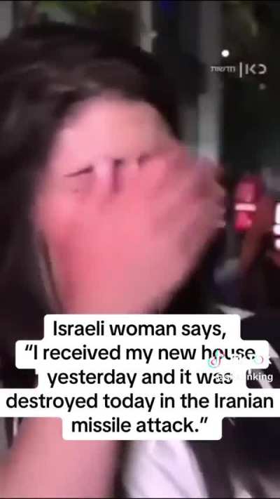 An Israeli woman cries as her house got destroyed under Iranian missile attacks