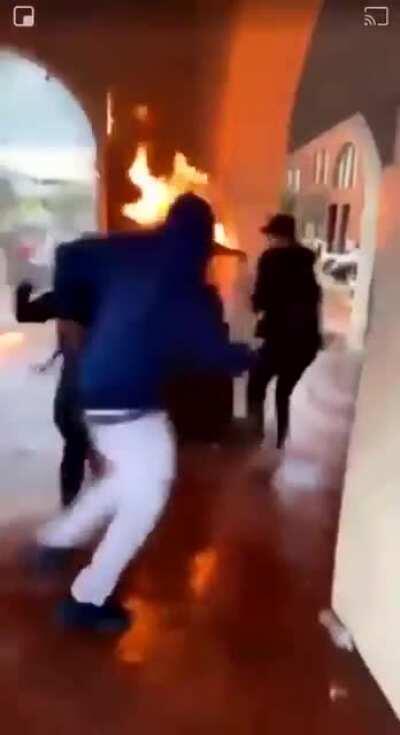 Dude accidentally sets himself on fire by trying to set a building on fire