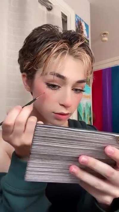 Addison Putting On Maleup