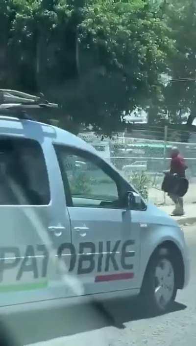 A typical hunt of a cholo with a chair and a mexican cowboy in the streets.
