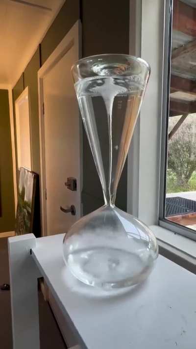 Whirlpool inside a hand-blown custom hourglass