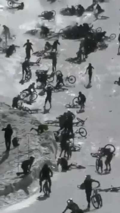 Calamity ensues when hundreds of cyclists ride down a ski slope