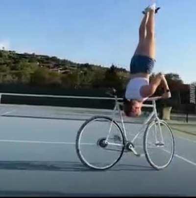 This girl takes riding a bike and performs the best stunts we've ever seen