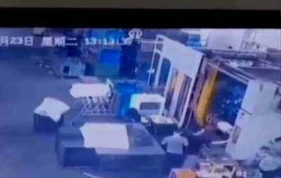 Worker climbs into molding machine in China 